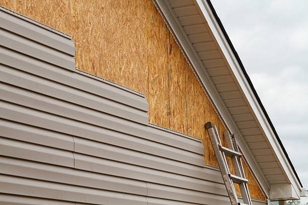 Professional Emergency Siding Repair technician working in Jackson Center, OH